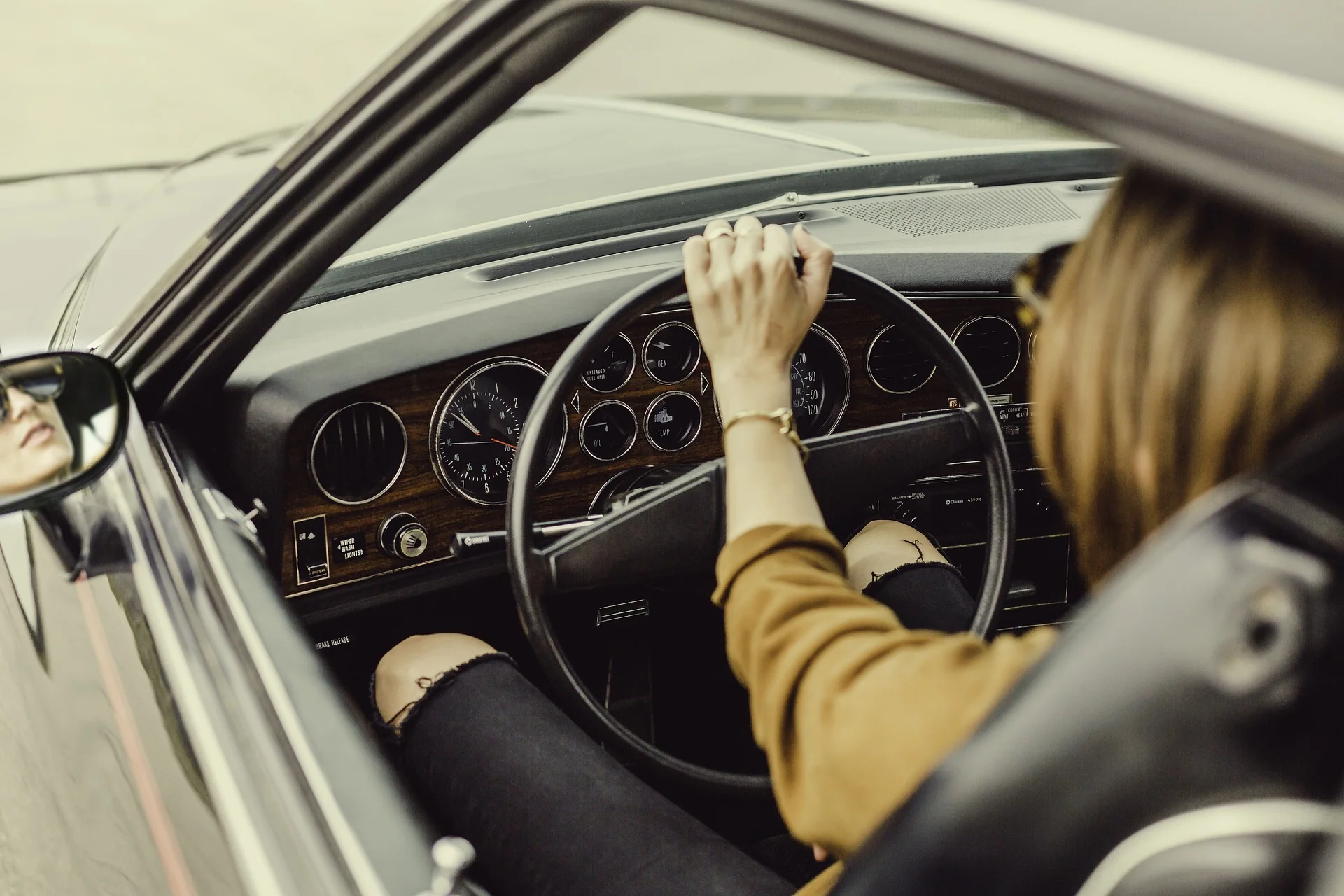 Woman driving vintage car
