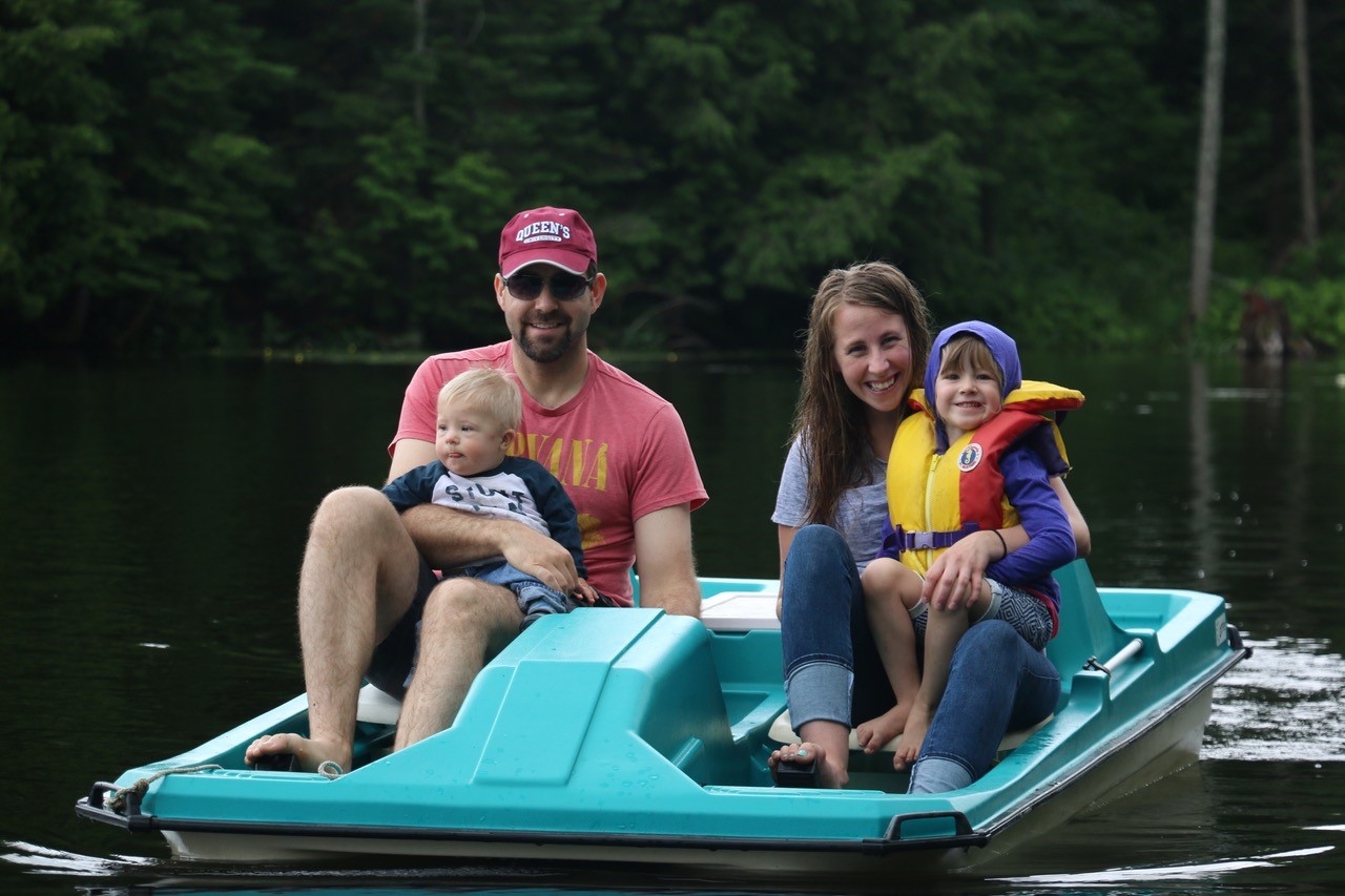 Alan and Natalie Mallory making memories with kids in paddleboat